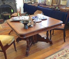 East Lake dining table with 5 extra leaves, carved apron, approximately 1890.  46" Square as shown and 30" High. With 5 leaves it would measure about 101" L