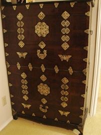 A pair of stacked Korean chests can form one tall unit or become two side tables with bases. (Both bases are present)