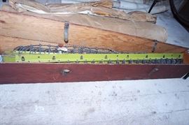 Military folding camp bed in box - mattress (unknown condition) rolled up behind it 