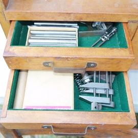 Small desk drawers full of tools