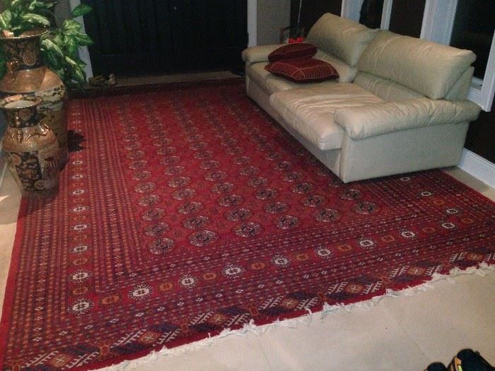 A rectangular, polychromatic
Persian wool rug with
geometric designs in shades
of red, orange, blue and white.
The piece has roughly 160
knots per square inch. The piece
is 148 inches long and 108
inches wide.