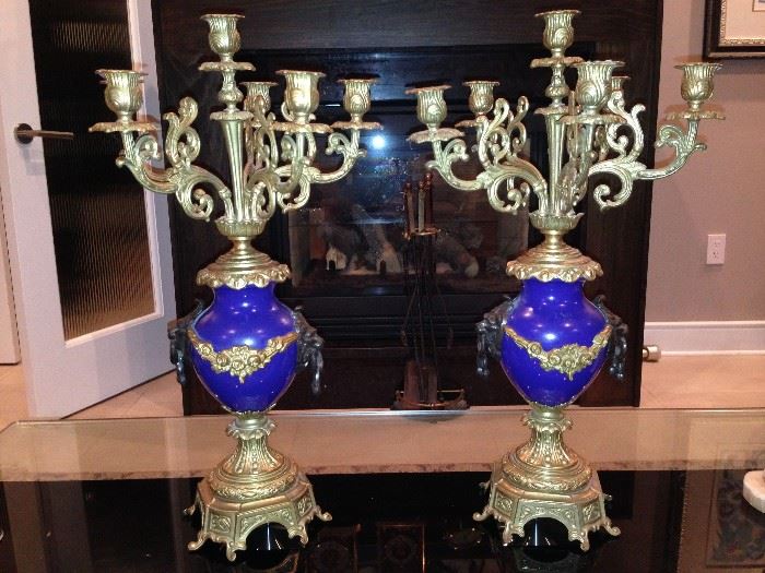 Candelabra set by Imperial
Clocks of Italy with brass and
cobalt blue porcelain. The
candelabras are 22 inches high
and 13 inches wide.