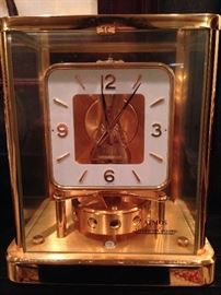A 1960s-era Jaeger-Lecoultre
perpetual motion Atmos mantle
clock with circular white face
with Arabic numerals and brass
minute and hour hands, 15
jewels and glass case. The
piece is 9.25 inches high, 7.5
inches wide and 5.5 inches
deep.