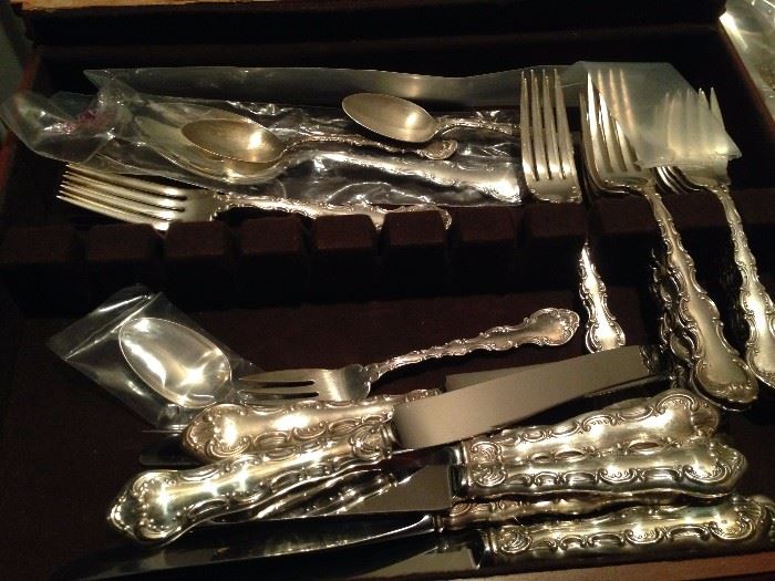 A 44-piece set of Gorham Strasbourg
pattern Sterling flatware, unmonogrammed
and including dinner
knives, dinner forks, table spoons, tea
spoons and serving utensils.