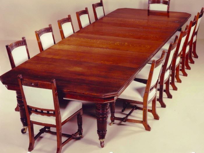 English Antique dining room table and 12 chairs, circa 1875, by Lamb of Manchester, England. W 55" L 72" extends to 22'