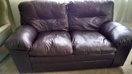 BROWN LEATHER LOVE SEAT....LIKE NEW AND COMFY !!
