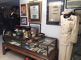 LARGE WWII COLLECTION FROM I VETERAN AND A LARGE ANTIQUE COUNTER TOP SHOWCASE WITH A BASE MADE TO USE AS A COFFEE TABLE