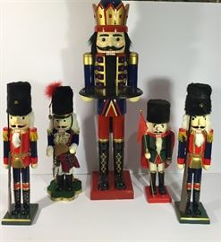 4 NUT CRACKERS 21" TO 24" TALL AND A CARD TABLE 42" TALL