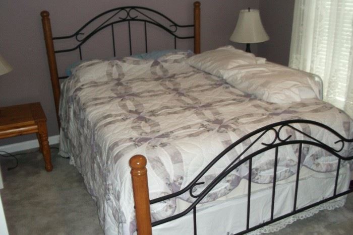 Wrought iron and pine bed