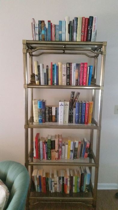 Large collection of books. Glass shelving unit also for sale.
