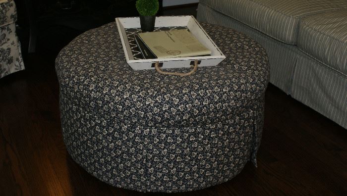 Round fabric covered ottoman