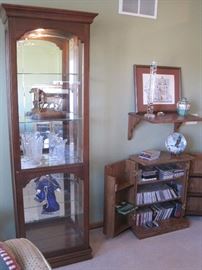 Display/curio cabinet. CD's. Dolls. 