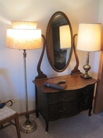 Lamps with vintage Mica shades. Oak dresser with oval mirror.