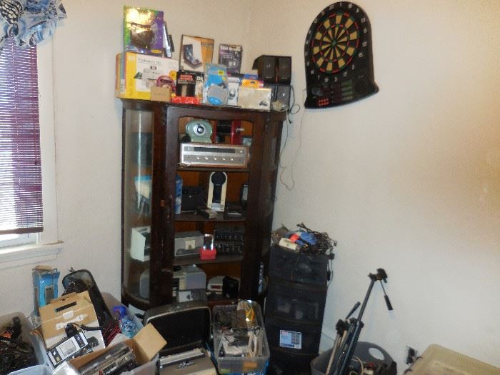 Electronic Room..Getting put back together.Wires, Cables, Remotes, Books, Radios, Dart Boards