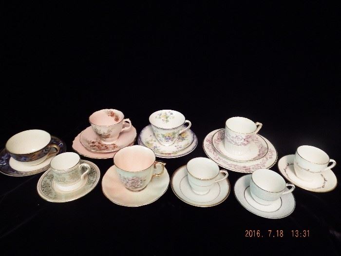 9 China tea cups with matching saucers and plates $40.00