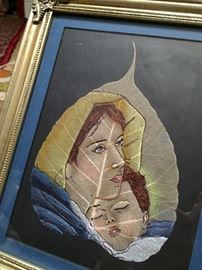 Madonna and child painted on a leaf. 