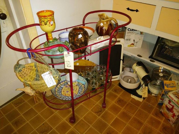 Cute kitchen cart.  Needs a bit of tightening up and paint to match your decor.