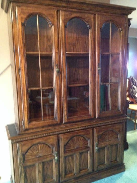 Two piece China cabinet by Renfrew Hall.  Lighted cabinet, glass shelves, pull out drawer, stationary shelves and cabinets in lower unit