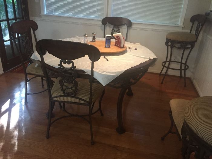 Glass, iron and wood dining table with 4 chairs, and 2 matching bar stools 