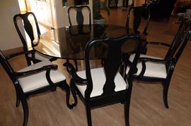 Smoked glass table and 6 chairs.