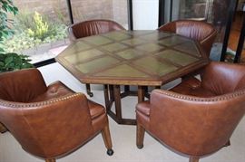 Leather chairs and octagonal table.