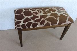 Giraffe needlepoint piano bench.