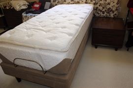 Sealy adjustable bed with topper.