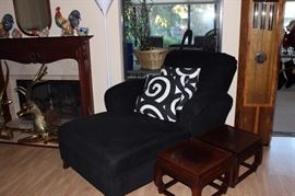 Black chaise, Asian tables, Howard Miller chiming clock.