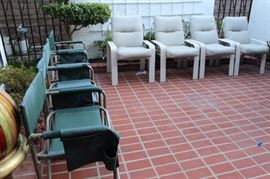 Four folding beach/camping chairs, four patio chairs with cushions.