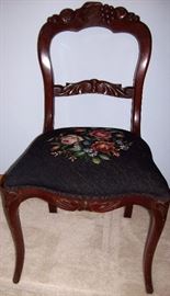            Needlepoint seat on carved fruit side chair