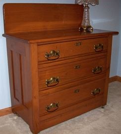           Antique three drawer oak chest w/backsplash