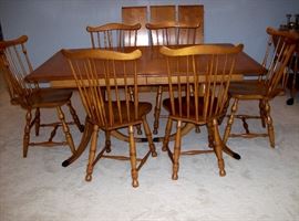 Maple double pedestal table, three leaves & six     spindle back chairs     