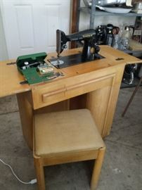 Vintage Singer sewing machine with mid-century cabinet, stool and accessories.  YES IT WORKS