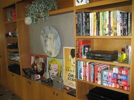 Assorted Hollywood-themed books, artwork, VHS player