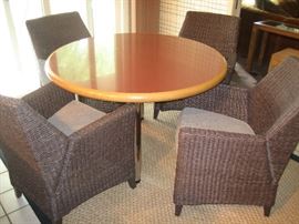 4 woven wicker side chairs and pedestal table