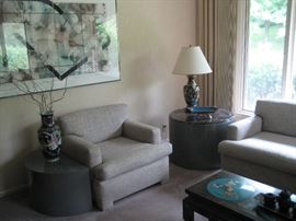 Sleek upholstered furniture and Asian accents