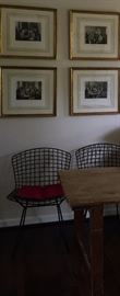 Game prints with custom gilt frames, Knoll chairs, and folding English wallpaper table