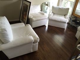 4 white leather club chairs (3 swivel)