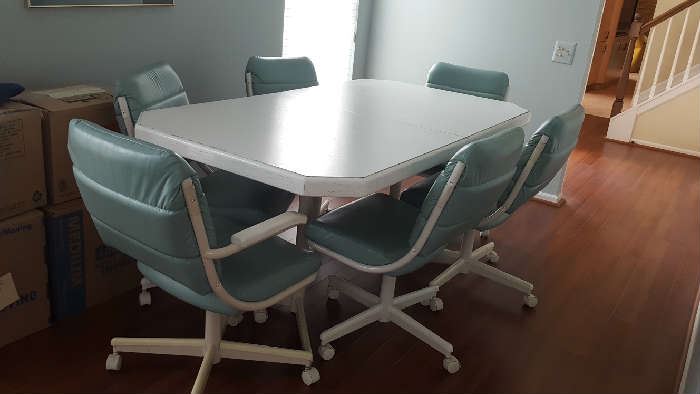 White kitchen table with 8 chairs and two extra leaves  $150