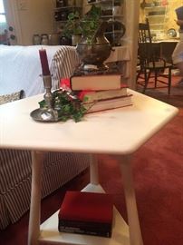 White hexagon table with triangular bottom shelf