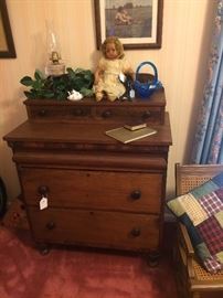 Four drawer antique chest; quilted pillow; child's antique rocker