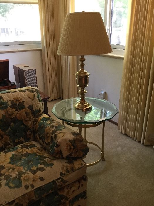 Brass lamp and glass side table