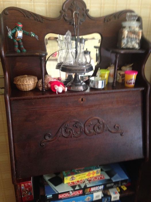 Original finish oak drop front secretary/bookcase.Condiment set in silverplate holder.