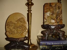 Carved soapstone plaques and stands