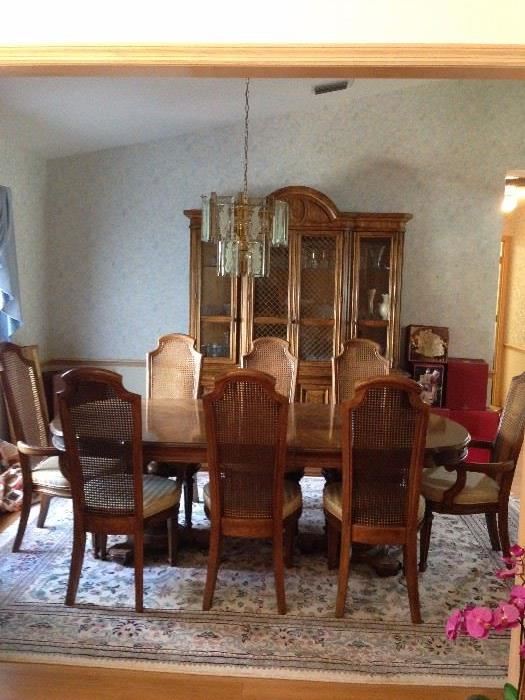 Mid Century American of Martinsville Table with 8 Chairs. Coordinating Hutch in the Back