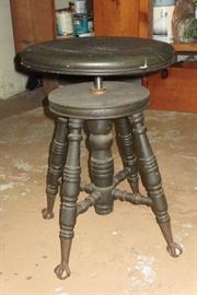Antique piano stool with glass feet