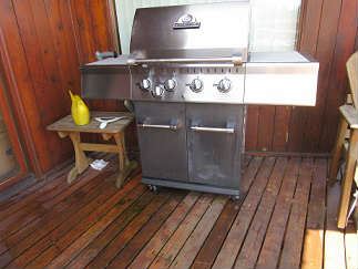 Outdoor grill with side shelf.  