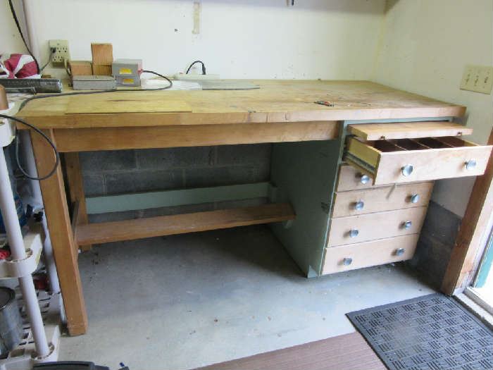 Maple top work table has pullout bread type board, and 4 drawers. It was made by a family member who enjoyed wood working. 