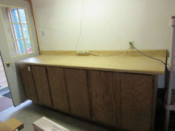 This cabinet has a butcher block top and interior shelves.  It is actually a triple cabinet.