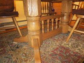 Dual pedestal base with spindle details